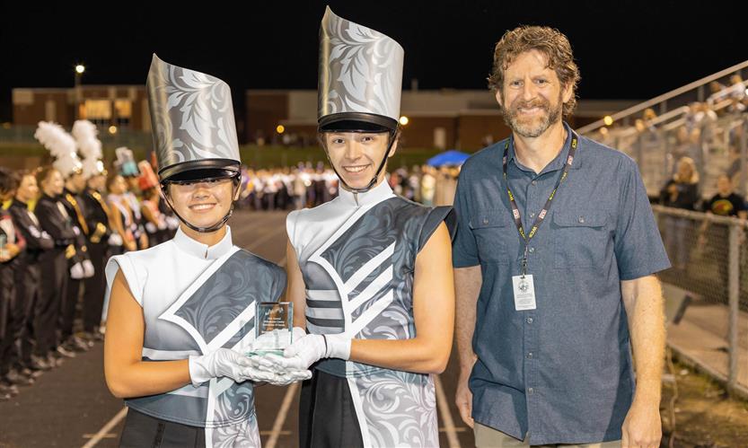 Bands perform on football field